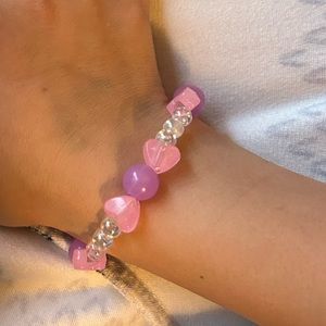 Child size bead bracelet. Glow in the dark. Pink beads. 6 inches on stretch cord
